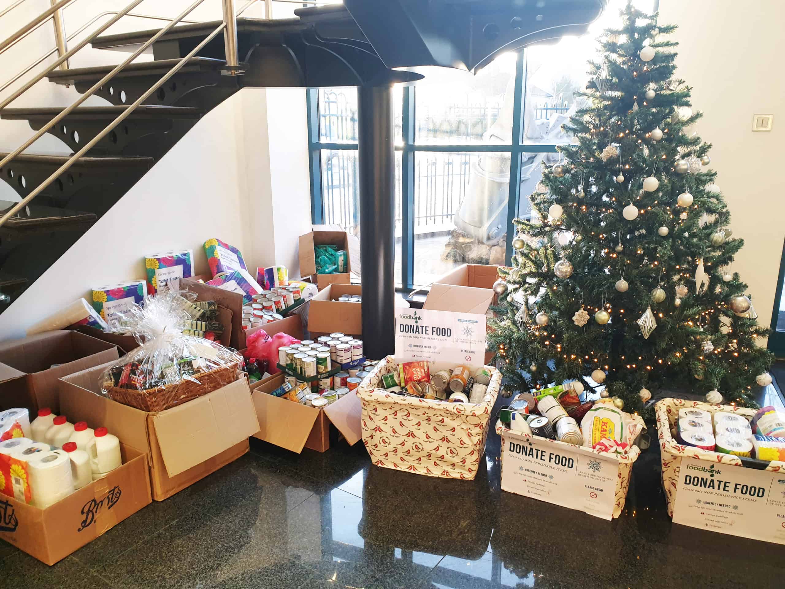 Thurrock food bank - John F Hunt donations - boxes of donations under Christmas tree