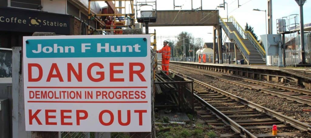 John F Hunt - Stanford Lee Hope train station - train tracks with Warning signage