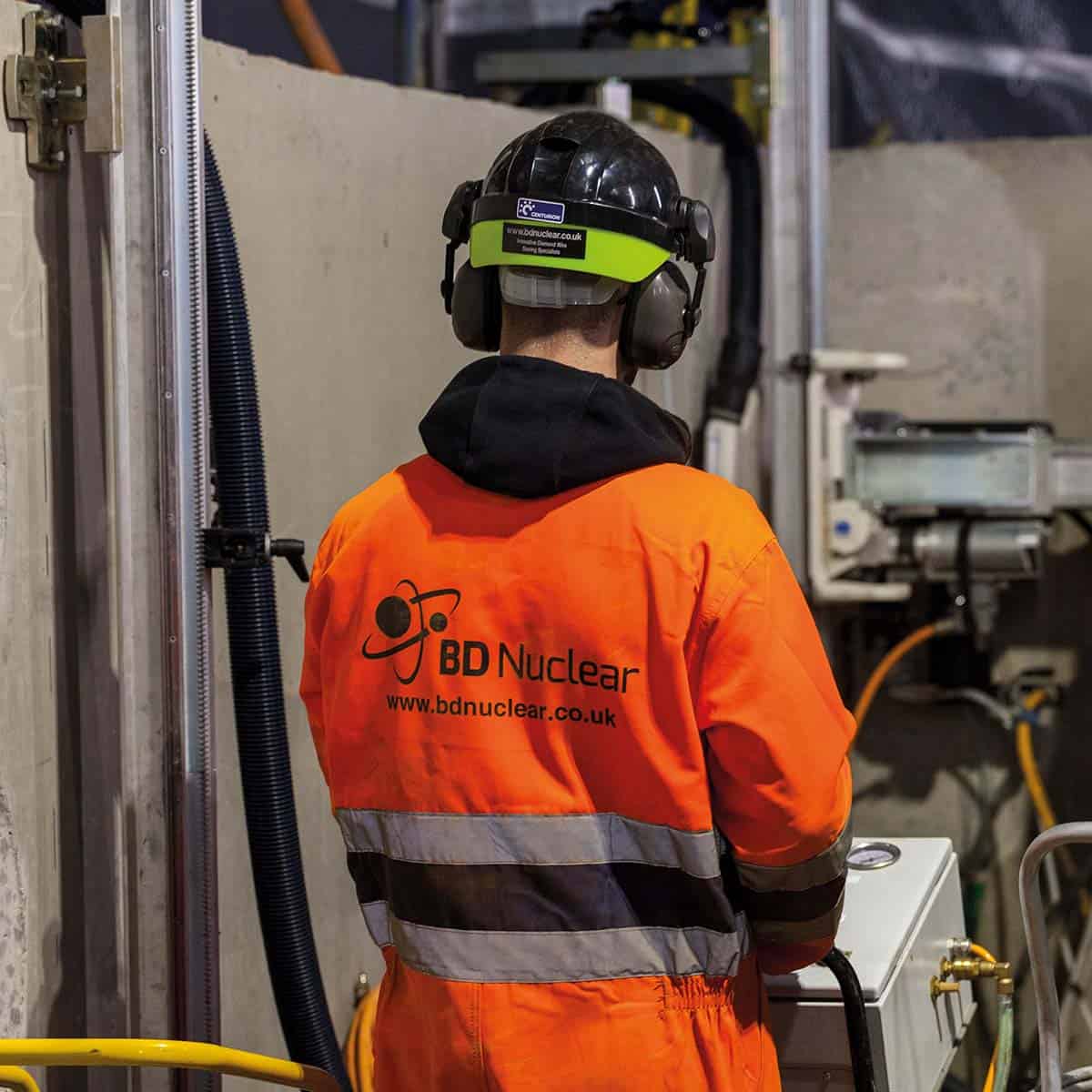 BD Nuclear employee from behind in workwear
